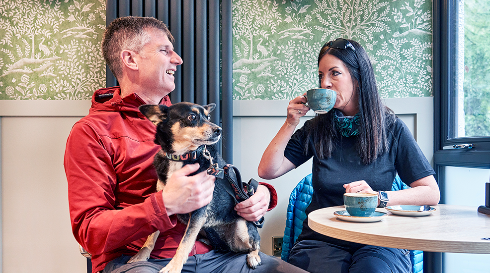 Rosie sits on Patrick's lap while he and wife Steph enjoy a hot drink